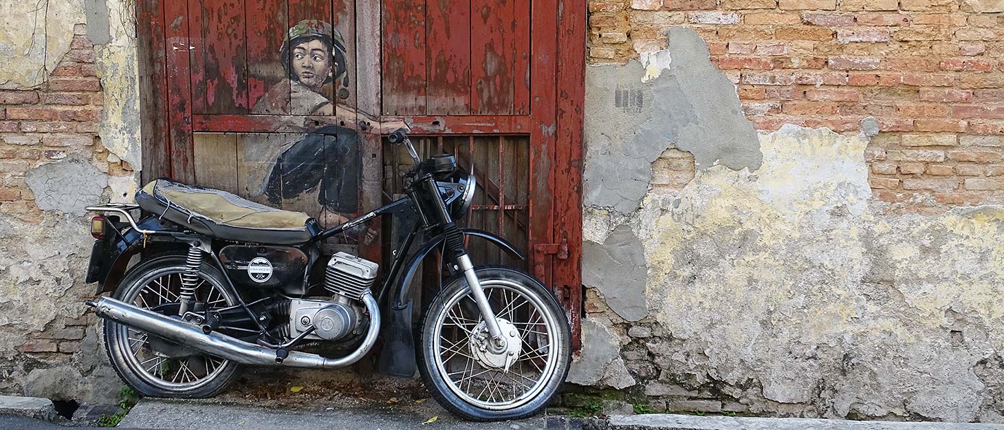 StreetArt-Bild Junge auf Motorrad